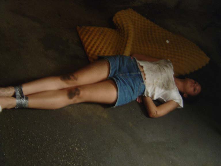 Here's our lead actress, Evelyn tied up on the floor. 